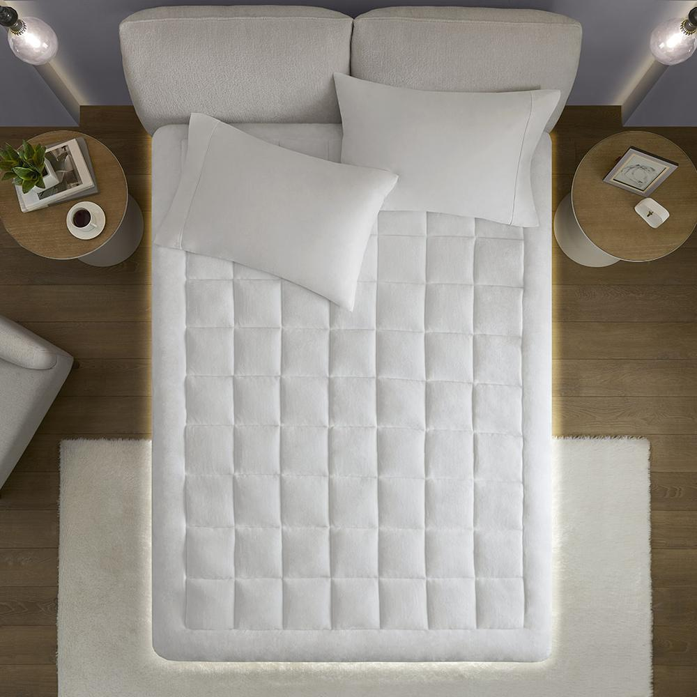 Start2Finish hypoallergenic waterproof mattress pad with plush overfilled down alternative filling, shown on a bed.