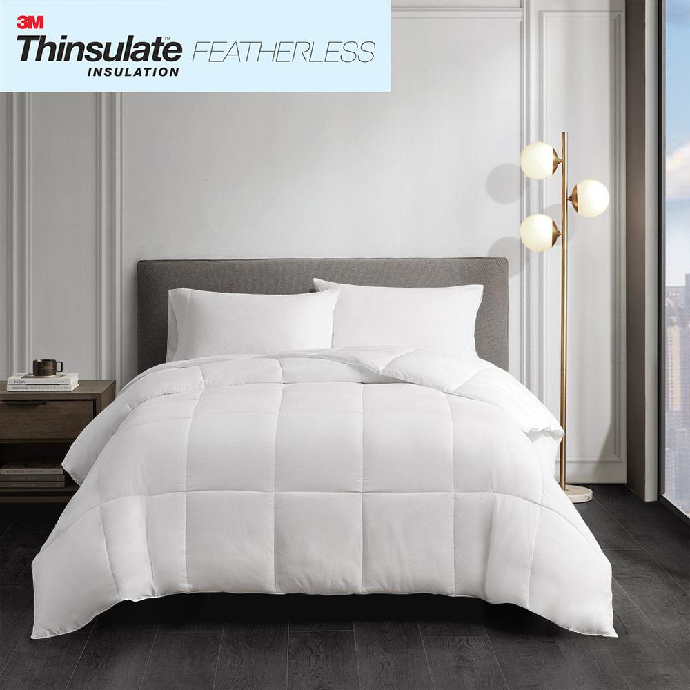 Light beige cotton down alternative comforter from Start2Finish showing plush, fluffy bedding with a smooth fabric surface.