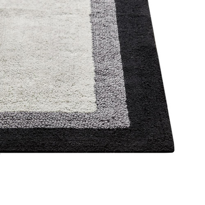 Start2Finish cotton tufted bath rug with a soft, plush surface in neutral tones, designed for bathroom comfort and style.