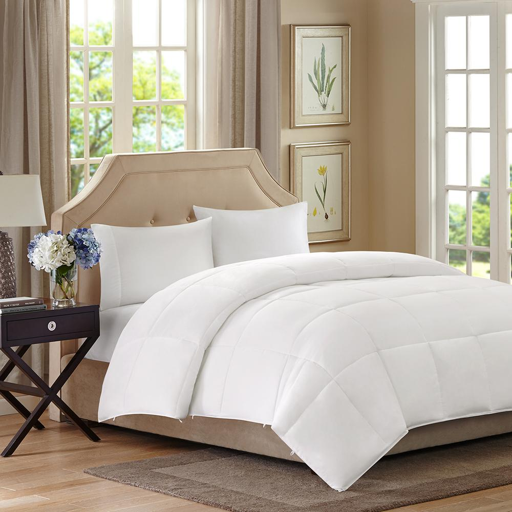 Start2Finish All Season 2-in-1 Down Alternative Comforter on a bed, showcasing its plush, layered design for year-round bedding.