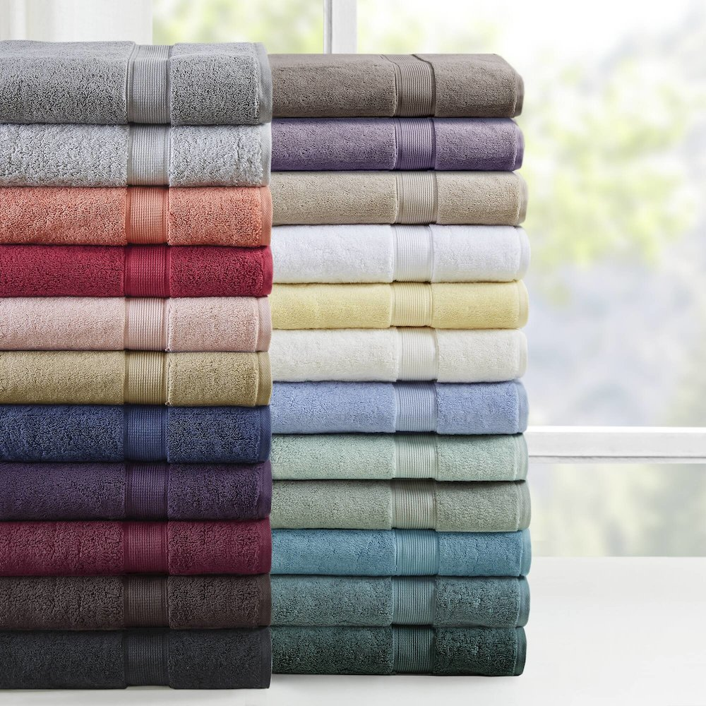 Start2Finish 8-piece cotton bath towel set featuring antimicrobial fabric, displayed with folded and hanging towels in neutral colors.