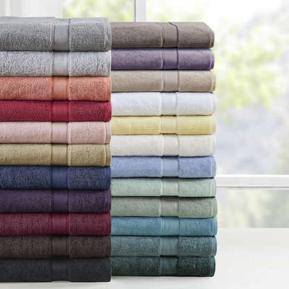 Start2Finish 8-piece cotton bath towel set featuring antimicrobial fabric, displayed with folded and hanging towels in neutral colors.