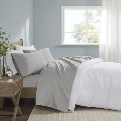 Start2Finish Pima Cotton Sheet Set with neatly folded white sheets and matching pillowcases, showcasing soft, high-quality bedding.