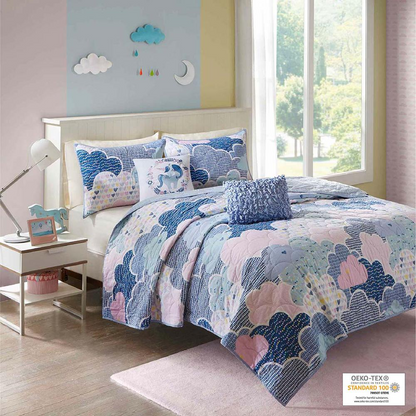 Reversible cotton quilt set with matching throw pillows on a neatly made bed, showcasing stylish bedding by Start2Finish.
