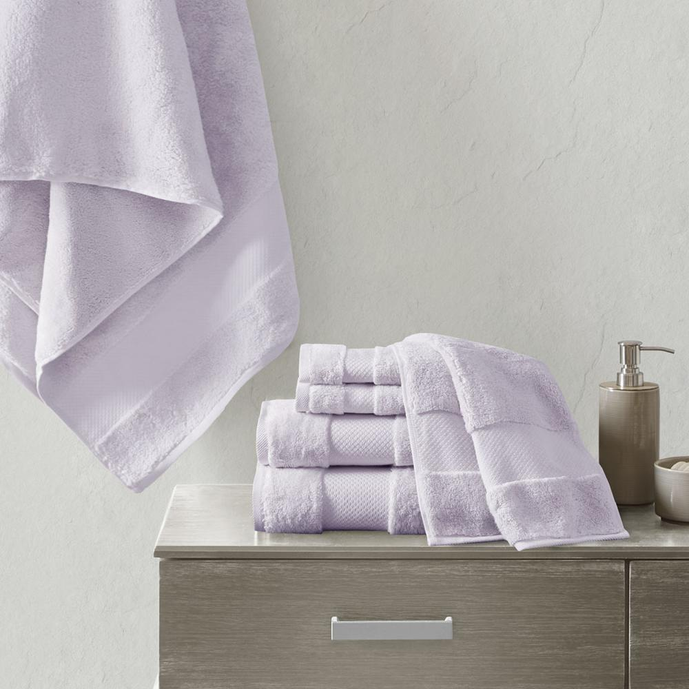Set of six soft white cotton bath towels from Start2Finish, neatly folded and stacked for a luxurious bath experience.