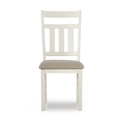 Distressed white side chair from Start2Finish with wooden legs and a cushioned seat, showcasing a rustic furniture style.