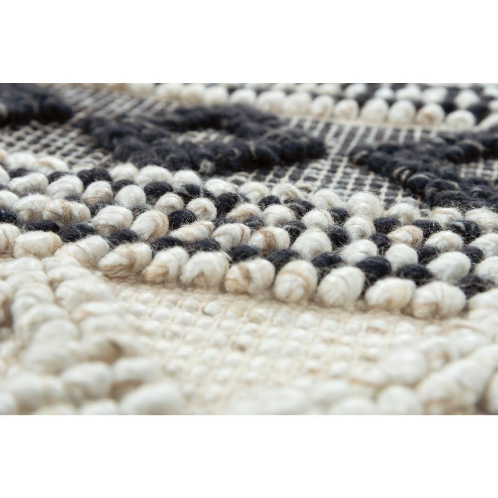 Hand-woven 5x8 rectangle rug by Start2Finish with intricate patterns and warm earthy tones on a neutral background.