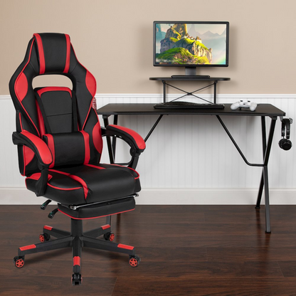 Start2Finish black gaming desk with headphone hook, monitor stand, red backrest, and adjustable arms gaming chair in a modern setup.