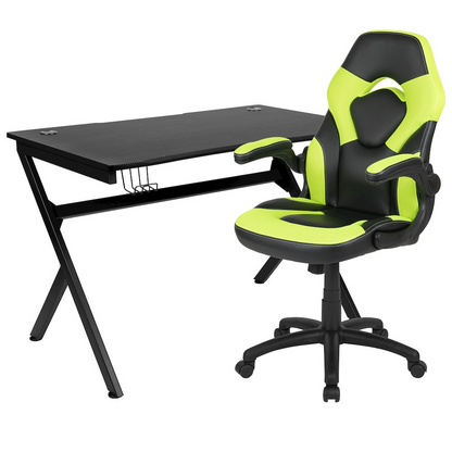 Start2Finish black gaming desk with a green and black racing chair, ergonomic setup for gaming and computer use.