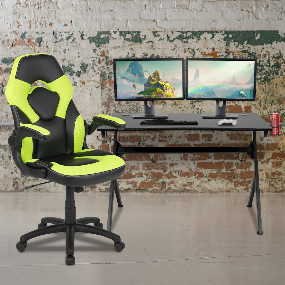 Start2Finish black gaming desk with a green and black racing chair, featuring a spacious tabletop and ergonomic design.