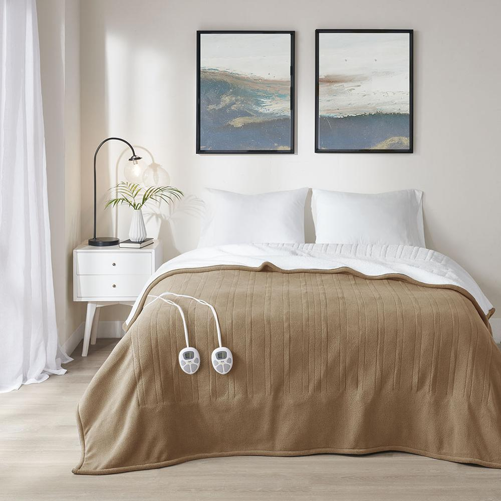 Start2Finish heated blanket spread out on a bed, showing its soft fabric and control panel for adjustable warmth.