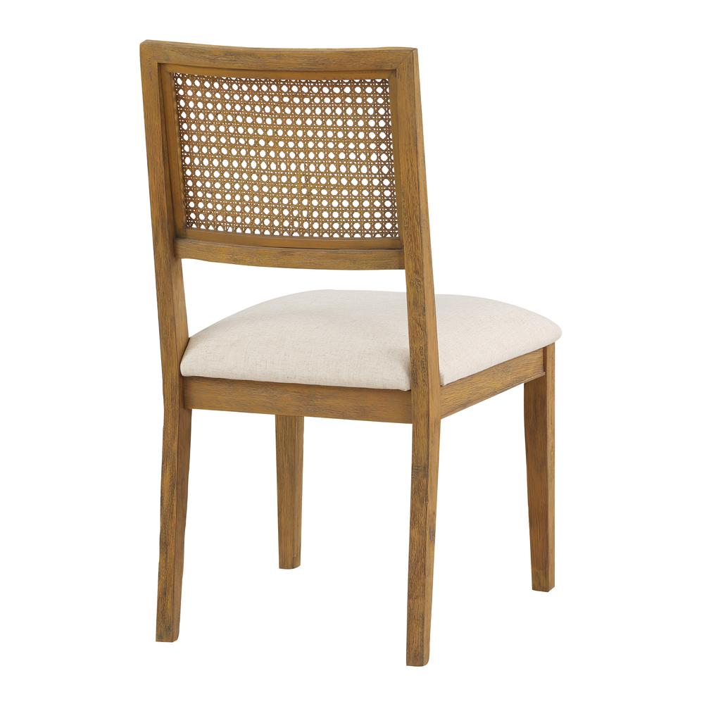 Two Start2Finish Alaina Cane Back Dining Chairs in linen fabric with coastal wash finish, featuring woven cane backrests and wooden legs.