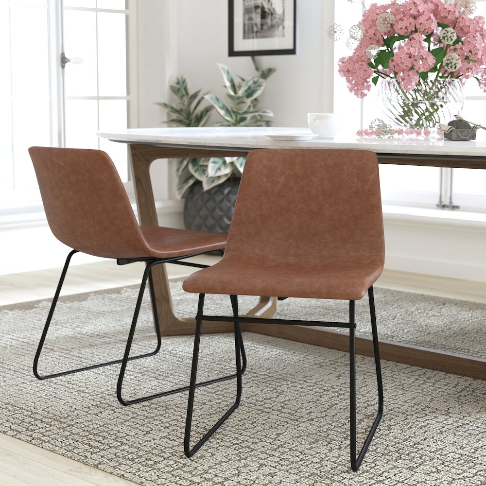 Set of 2 Start2Finish 18-inch light brown mid-back sled base dining chairs with black frames, showing upholstered seats and sleek design.