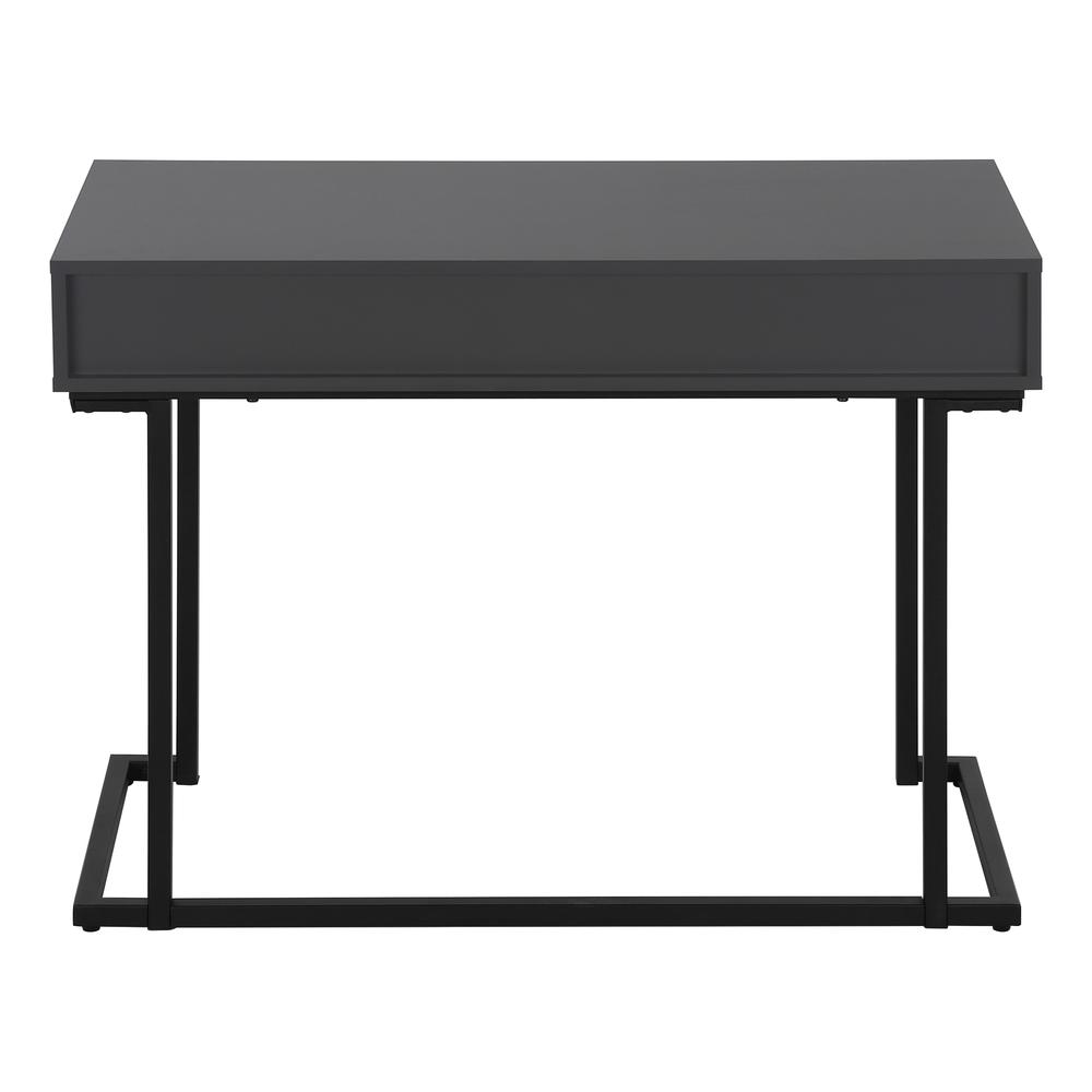 Grey laminate computer desk with storage drawers, ideal for home office setup, featuring workspace for laptop and work essentials.