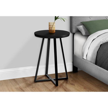 Black round accent side table with lamp, ideal as a nightstand or end table for living room or bedroom decor.
