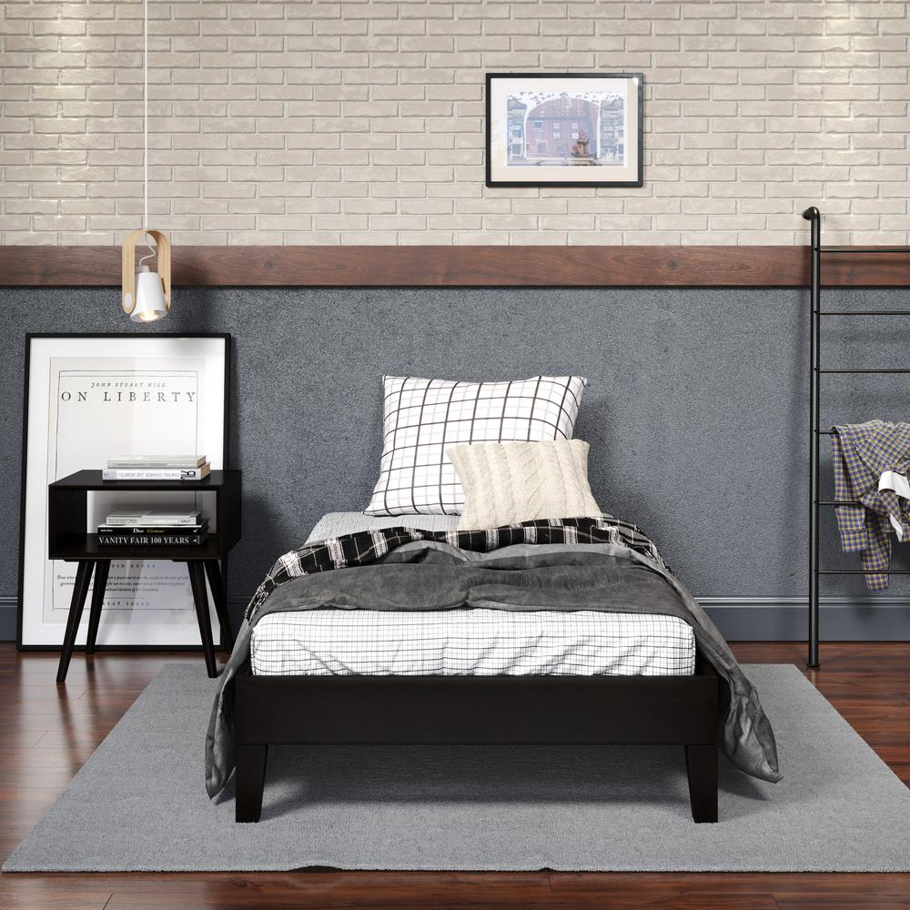 Black Nix solid wood platform bed by Start2Finish with a sleek, modern design and sturdy frame, shown in a well-lit bedroom setting.