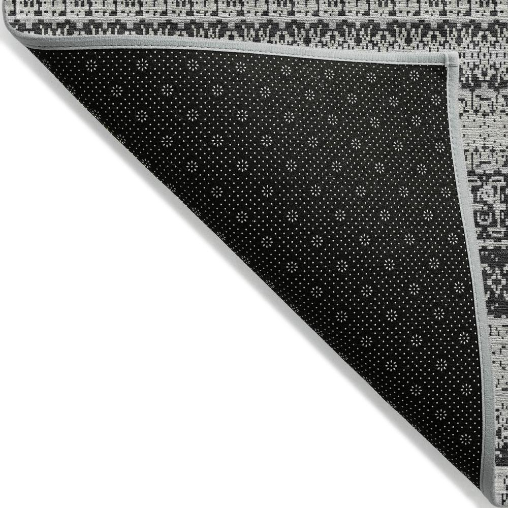 Start2Finish Chantille ACN576 black 9x12 rug featuring a plush, textured surface with intricate patterns and fringed edges.