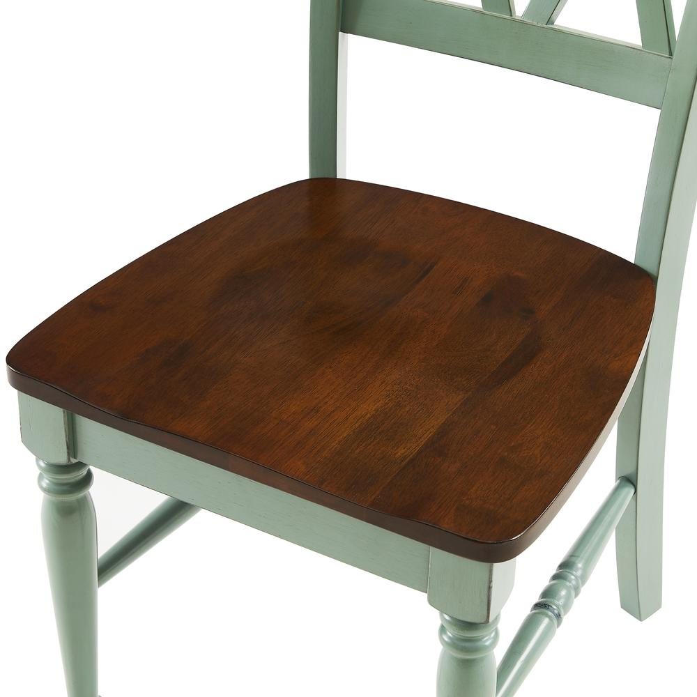 Set of two Shelby dining chairs by Start2Finish, featuring modern design with cushioned seats and sleek wooden legs.