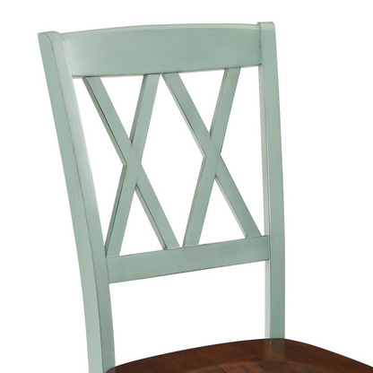 Set of four Shelby Start2Finish dining chairs with wooden legs and upholstered seats, arranged around a dining table.