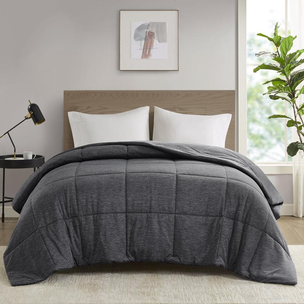 Start2Finish oversized down alternative comforter on a bed, showcasing its plush, cozy bedding style and soft fabric.