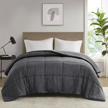 Start2Finish oversized down alternative comforter on a bed, showcasing its plush, cozy bedding style and soft fabric.