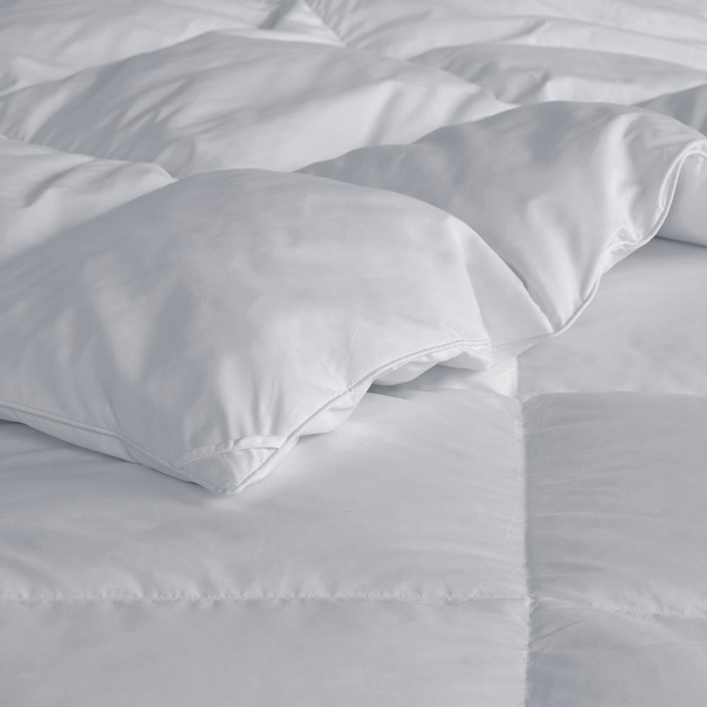 Large goose feather and down oversize comforter from Start2Finish showing soft, plush bedding with a cozy, inviting appearance.