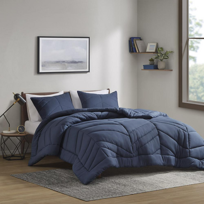 Start2Finish Quilted Chevron Comforter Set in soft bedding with a stylish chevron pattern on a cozy bed.