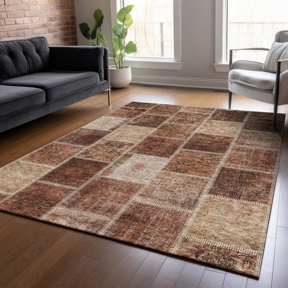 Start2Finish Chantille ACN772 orange rug, 10x14 feet, featuring a textured, plush surface with a vibrant orange color and decorative pattern.