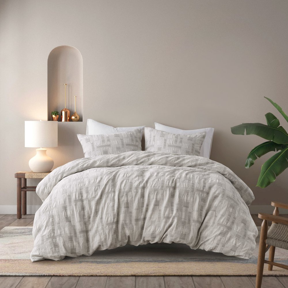 Ivory Cairo 3-piece cotton jacquard duvet bedding set by Start2Finish, showing the textured jacquard pattern and matching pillow shams.