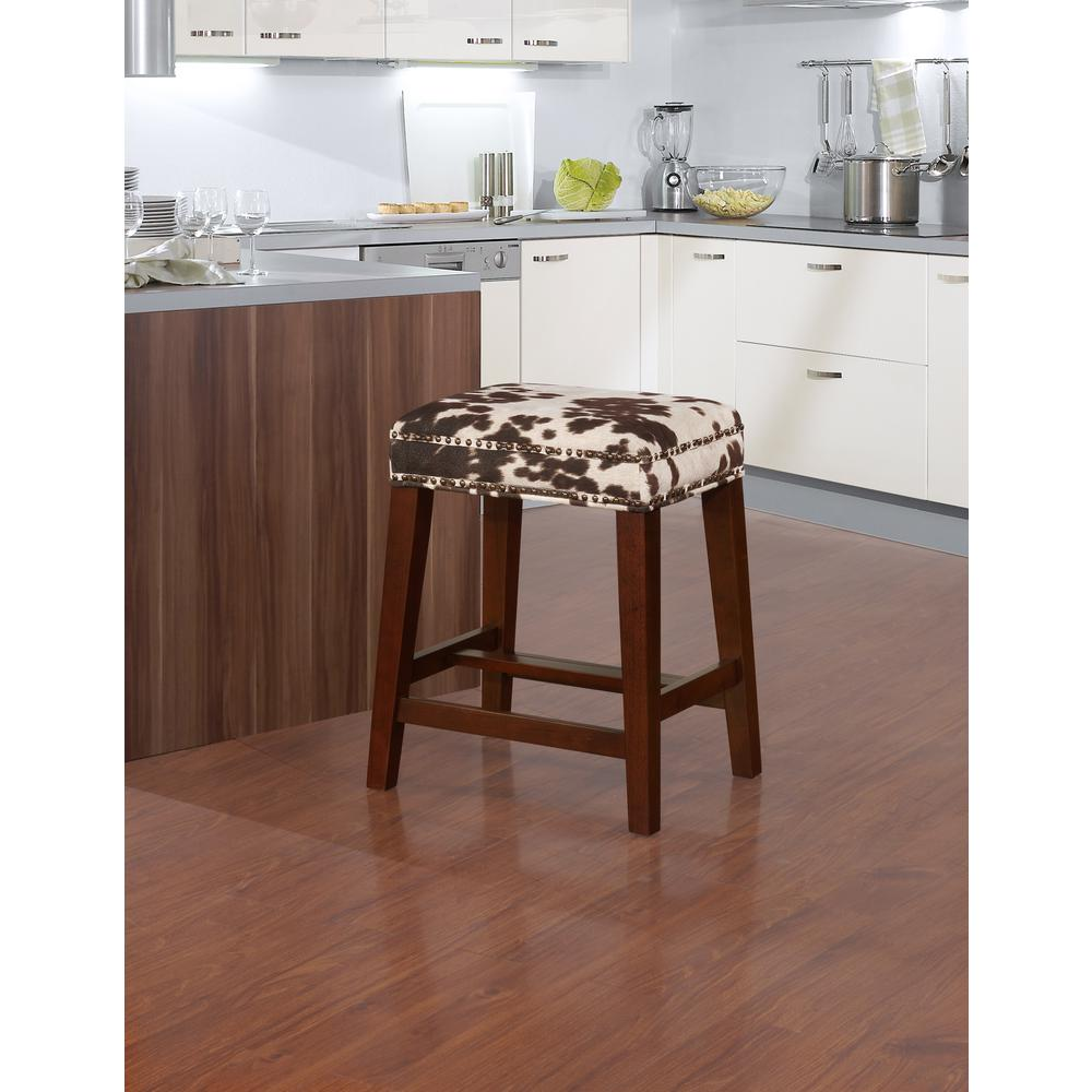 Walt Brown Cow Print Counter Stool by Start2Finish with wooden legs and cushioned seat featuring cow print fabric.