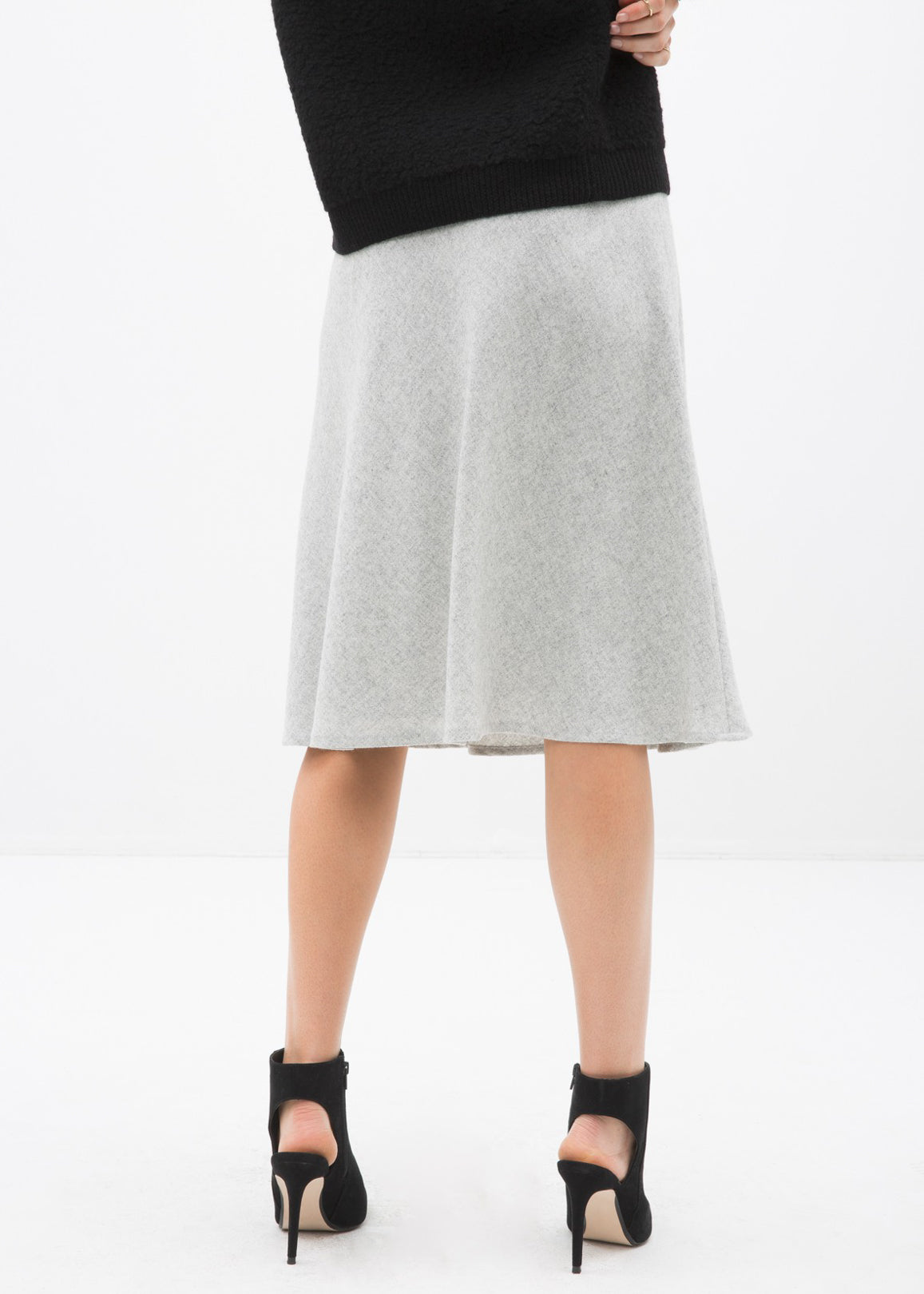 High waisted wool knit midi skirt in Heather Grey by Lemon Hera, showcasing its soft texture and elegant length.