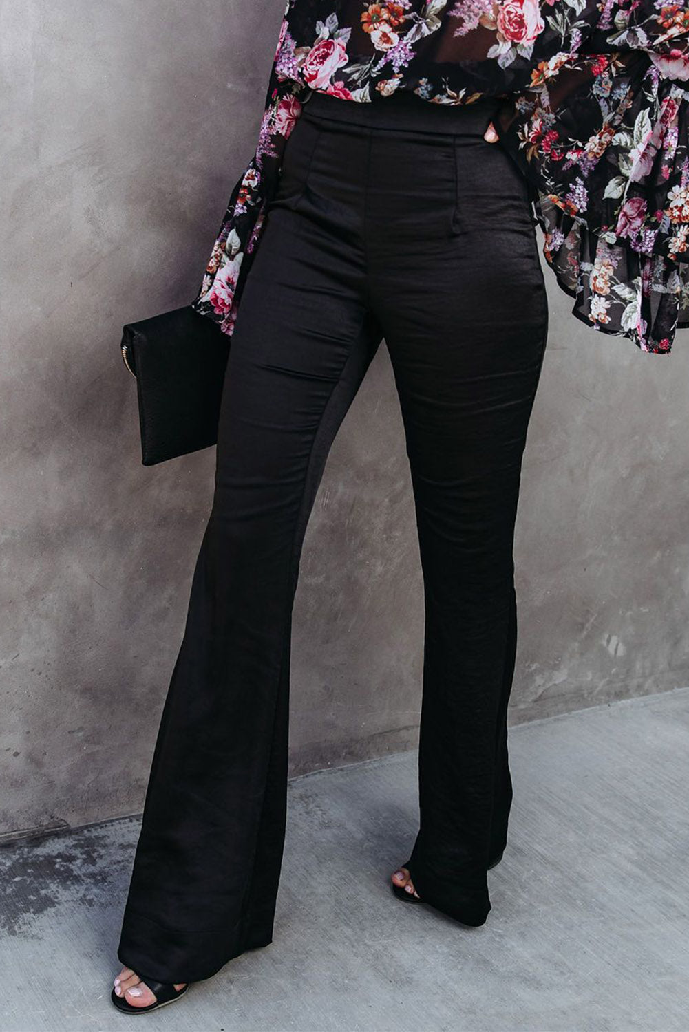Black satin flare tailored pants by Harlequin Daisy, showcasing sleek, fitted design with flared legs and smooth satin fabric.
