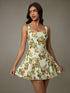 Taupe Oliver floral sleeveless mini pleated dress, stylish T-shirt with vibrant floral pattern and lightweight fabric.