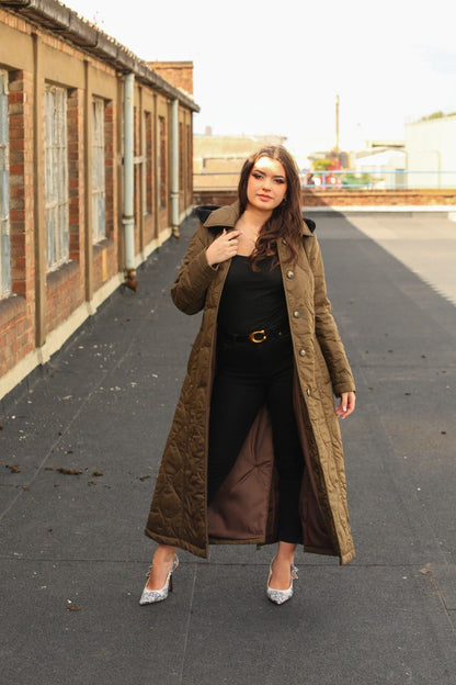 Rose Eleusis quilted single-breasted longline hooded coat with padded design, shown hanging on a clothing rack.