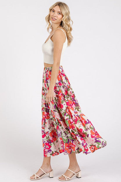 Automotive image of Jade Icarus Mittoshop floral print elastic waist tiered skirt, showcasing colorful tiered fabric and flower pattern.