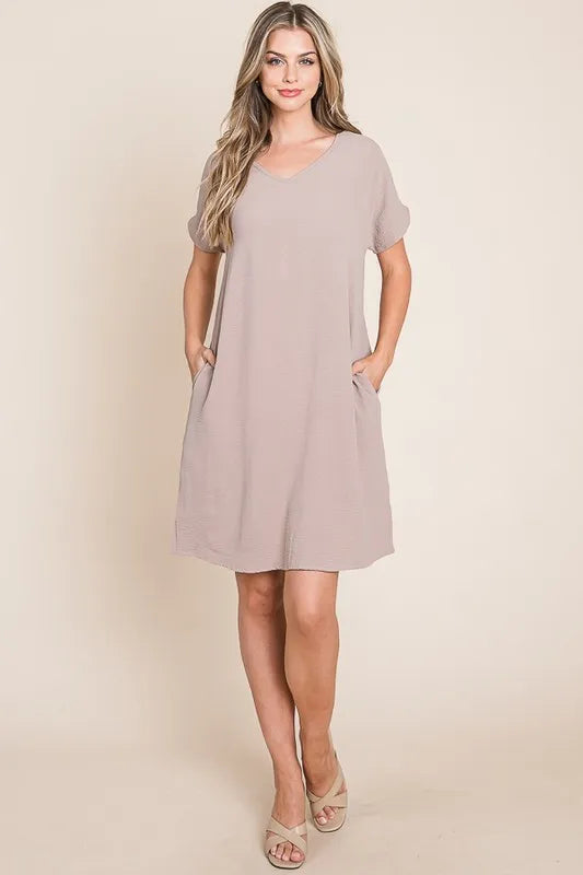 Automotive Jade Icarus BOMBOM V-Neck Short Sleeve Dress with Pockets, featuring a stylish design and comfortable fit.