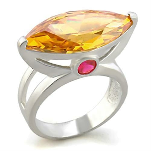 Rhodium brass ring with AAA grade champagne CZ by Turquoise Tiger, showcasing a polished band with sparkling gemstone accents.