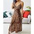 Lady wearing a leopard print butterfly design dress by Pear Daisy, featuring straps and a flowing style, suitable for home and garden.