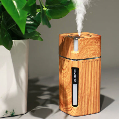 Maroon Asteria ultrasonic air humidifier with USB mini mist maker, LED light, compact home improvement device, emits fine mist.