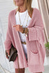 Pink oversized fold-over sleeve open-front cardigan by Carmine Juneberry, featuring a relaxed fit and cozy knit fabric.