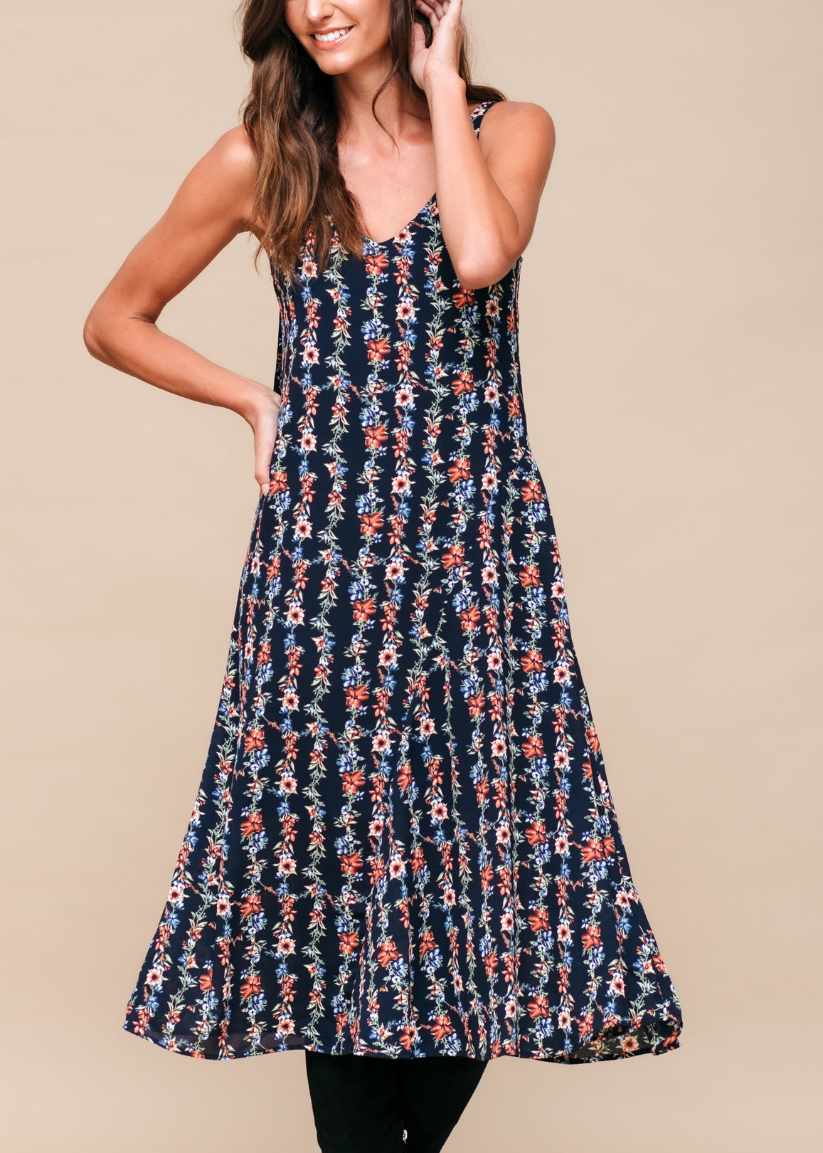 Floral V-neck sleeveless maxi dress by Lemon Hera featuring a black print, flowing fabric, and a stylish, elegant design.