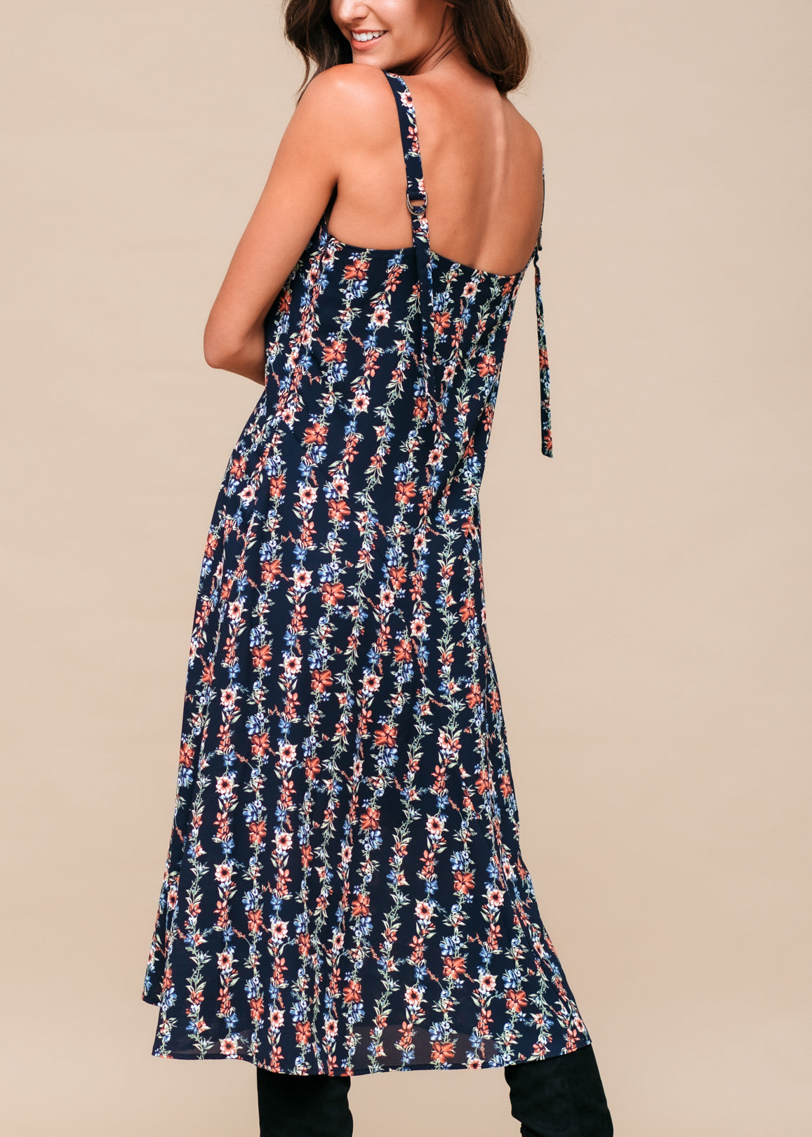 Black floral V-neck sleeveless maxi dress by Lemon Hera, featuring a flowy silhouette and vibrant floral print.