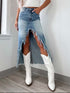 Women’s high-waist raw hem asymmetry denim skirt from Taupe Oliver, styled with a casual top.
