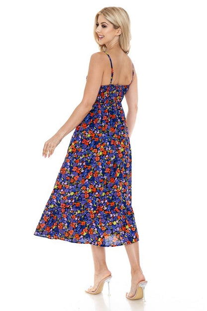 Women’s floral maxi dress by Jade Icarus featuring a flowing silhouette and vibrant flower pattern, perfect for summer or casual wear.