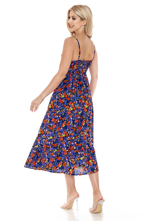 Women’s floral maxi dress by Jade Icarus featuring a flowing fabric, vibrant floral pattern, and sleeveless design.