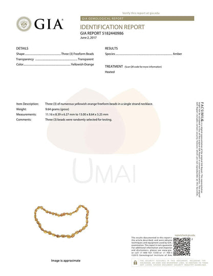 Tan Eurynome fertility amber bracelet featuring polished amber beads on a delicate string, designed for jewelry and wellness.