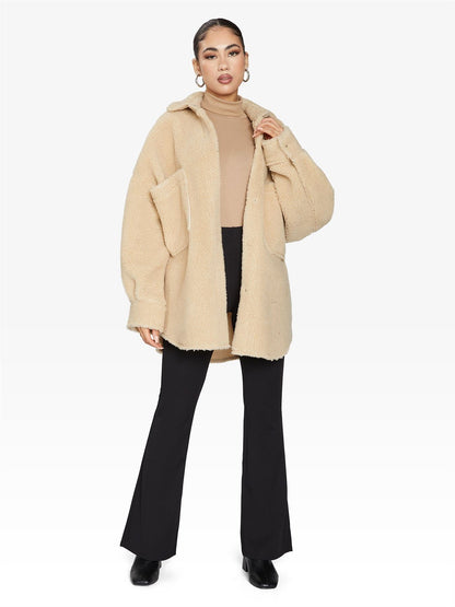 Rose Eleusis oversized patch pocket borg teddy shacket featuring a cozy, plush fabric, large front pockets, and a relaxed fit.