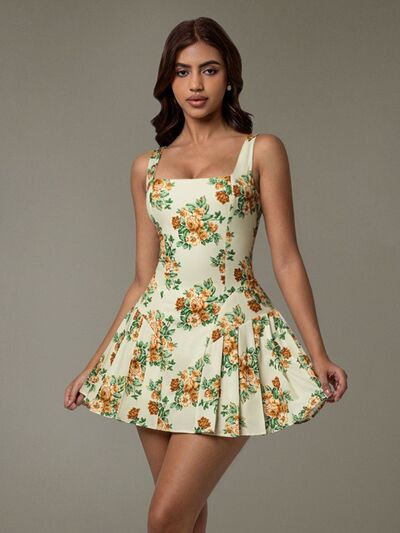 Taupe Oliver floral sleeveless mini pleated dress T-shirt with vibrant floral pattern and lightweight fabric.