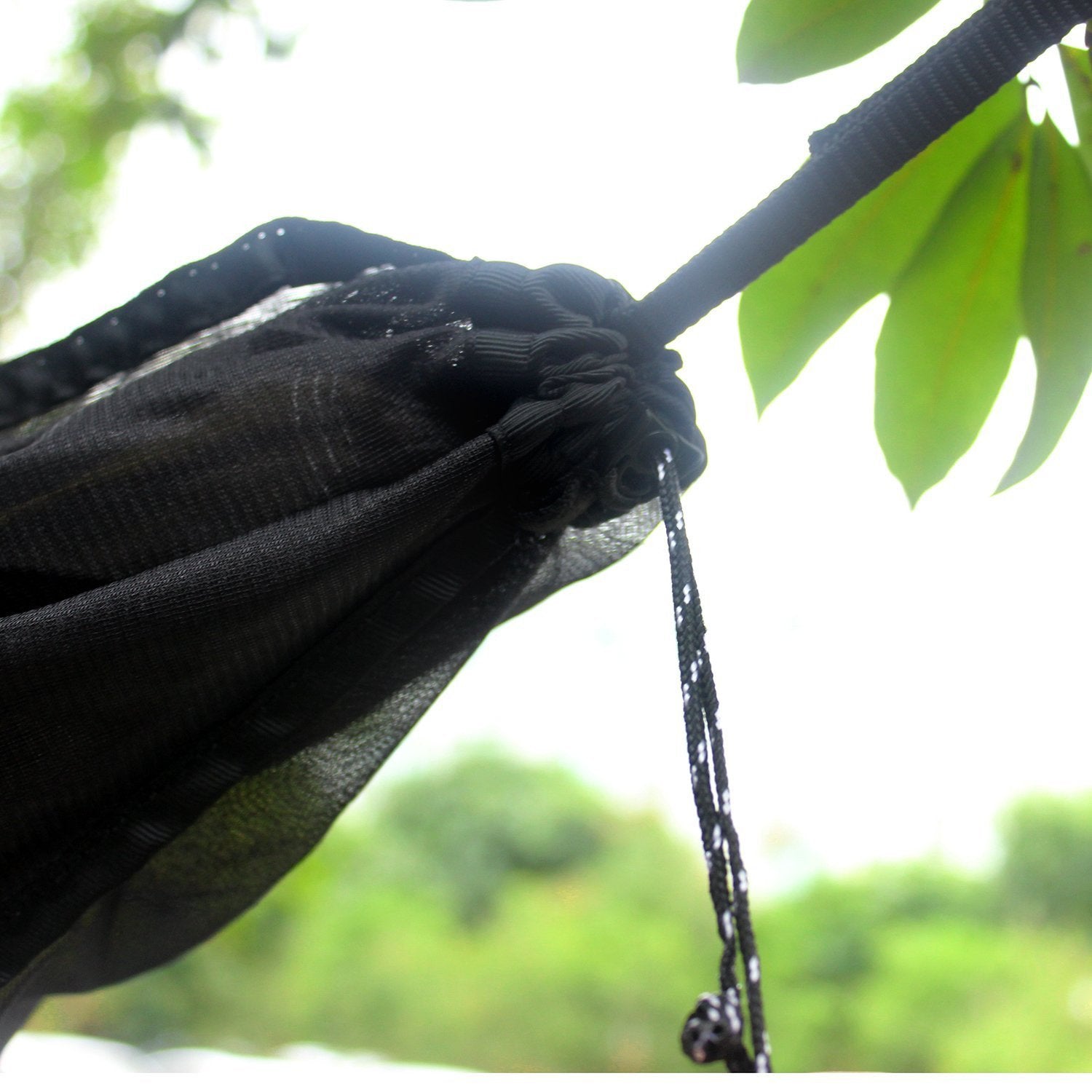Indigo Eurybia hammock bug net with 360° protection, lightweight outdoor gear for camping and relaxing in nature.