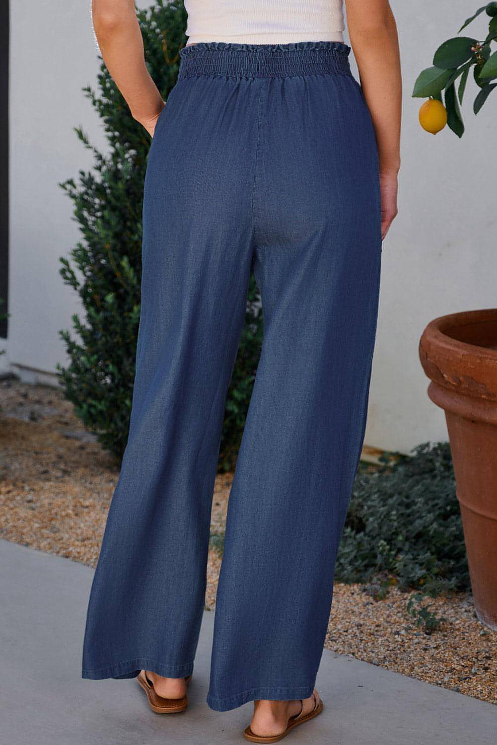 Carmine Juneberry Sail Blue high waist wide leg jeans with side pockets, frilled details, and smocked waistband.